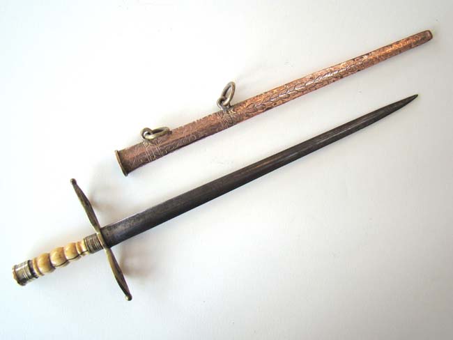 A Britsh Naval 'Fighting' Dirk with original engraved copper scabbard circa 1800-1820